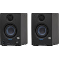 Black studio monitor speaker with blue woofer ring and tweeter grille, front view