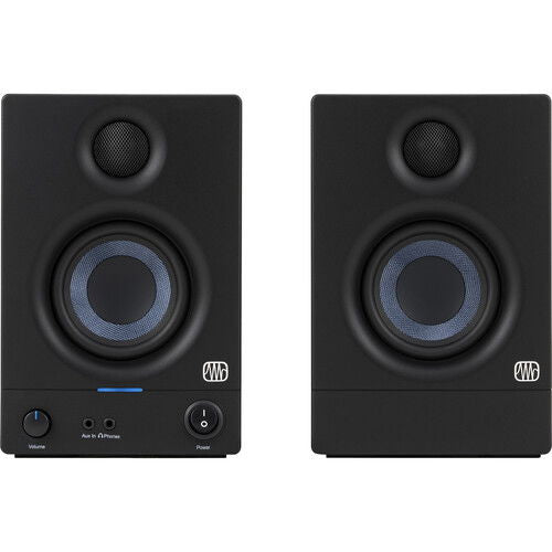 Front view of black studio monitor speaker with blue woofer ring and control buttons