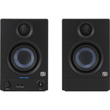 Front view of black studio monitor speaker with blue woofer ring and control buttons