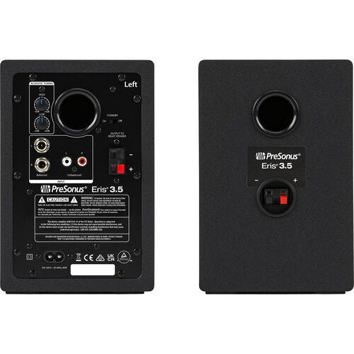 Back panel of black studio monitor speaker with ports, label area, and connection jacks