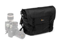 Black camera messenger bag with flap, buckles, and padded shoulder strap