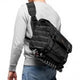 Black crossbody camera bag worn on shoulder with adjustable strap