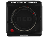 Komodo-X camera front close-up with lens cap, lock ring markings, and red buttons