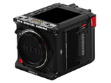 Komodo-X camera front-right view with lens, top buttons, and red media marker