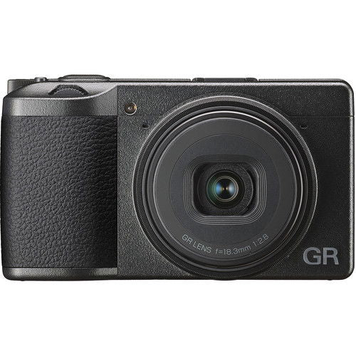 Black compact camera front view with large lens glass and GR logo on right