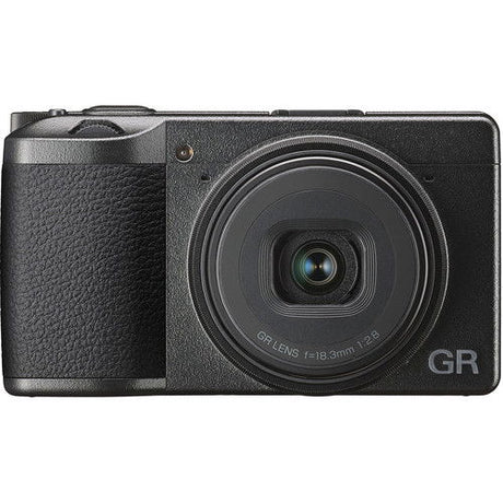 Black compact camera front view with large lens glass and GR logo on right