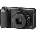 Black Ricoh compact camera with built-in zoom lens and GR branding on front