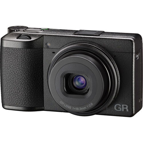 Black Ricoh compact camera with built-in zoom lens and GR branding on front