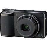 Black compact digital camera angled view showing lens front and GR branding