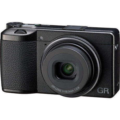 Black compact digital camera angled view showing lens front and GR branding