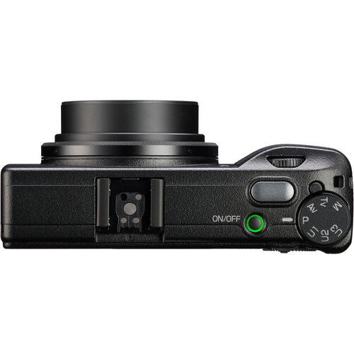 Black compact digital camera top/side view with control dial and ports