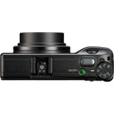 Black compact digital camera top/side view with control dial and ports