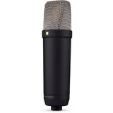 Black studio condenser microphone, side view with mesh grille and base