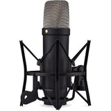 Black studio condenser microphone with shock mount and metal mesh grille