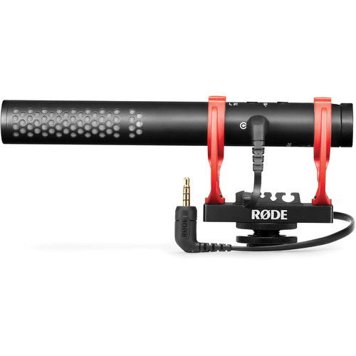 Black shotgun microphone with red shock mount, visible output connector and cylindrical body