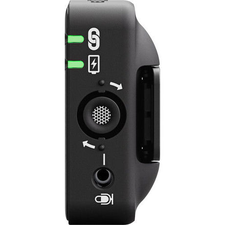 Side panel of black Wireless ME TX transmitter/recorder with speaker grille and control buttons