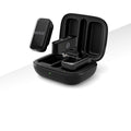 Open charging case with two black wireless mic transmitters