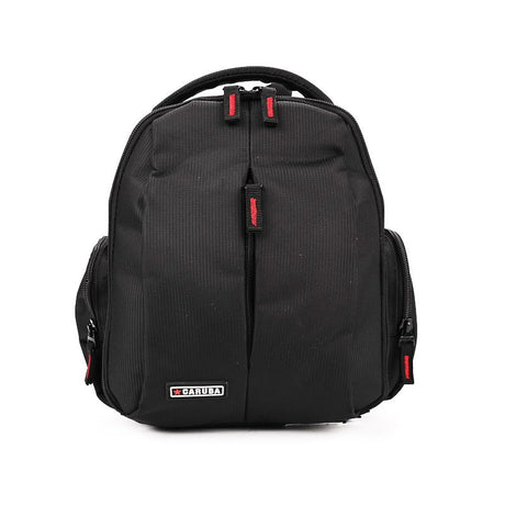 Black photo-video backpack with top handle, zip front panel, red accents and logo patch.