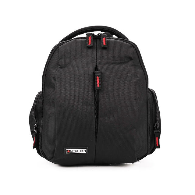 Black photo-video backpack with top handle, zip front panel, red accents and logo patch.