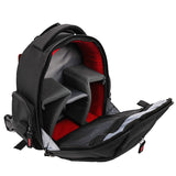 Open black camera backpack with red-lined interior, padded compartments, and zipper storage.