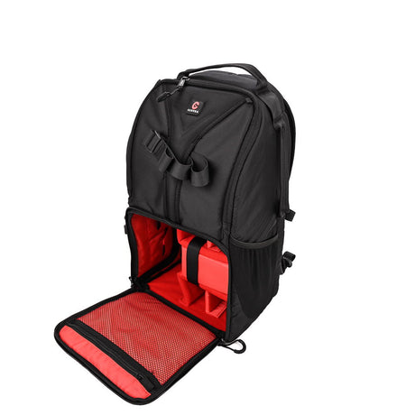 Black camera backpack with fold-out base revealing red padded panel and mesh insert