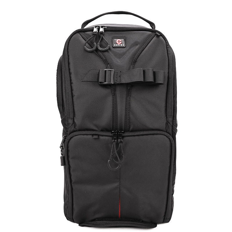 Black camera backpack with front harness straps and zip pocket, compact Skydex 10