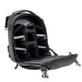 Open black camera backpack interior with padded dividers and adjustable strap