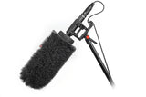 NTG shotgun microphone with long black fur windscreen, cable and mount bracket