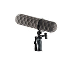 Gray foam windscreen for shotgun microphone, mounted on a handheld shock mount