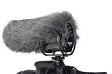 Gray furry microphone windscreen with mounting bracket on a video camera
