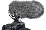 Gray foam microphone windscreen with shock mount straps on a camera top