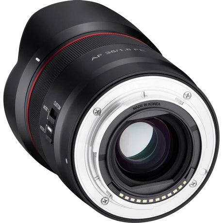 Rear mount side of black lens with silver electrical contacts and AF 35/1.8 FE markings