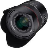 Front view of black 35mm f/1.8 FE lens with red ring and glass element