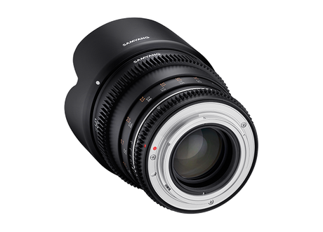 Three-quarter view of black 50mm T1.5 VDSLR lens with front glass and focus ring
