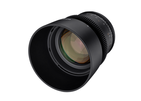 Angled view of black 85mm T1.5 MFT lens with visible glass and outer focus ring