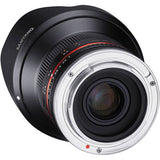 Wide-angle mirrorless lens with silver mount ring and black barrel, front glass