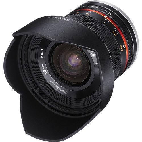 Black wide-angle mirrorless lens with hood, front glass and focus ring markings