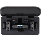 Front view of open charging case with two transmitters and receiver screen