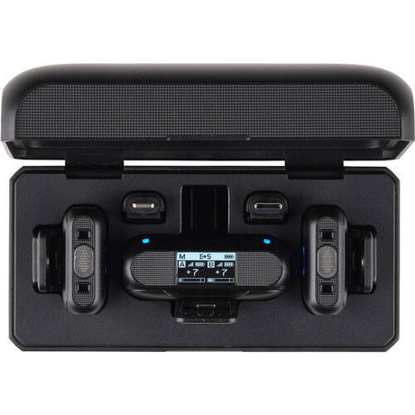 Front view of open charging case with two transmitters and receiver screen