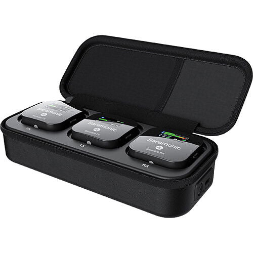 Open black carrying case with three wireless mic units and foam windscreen pieces