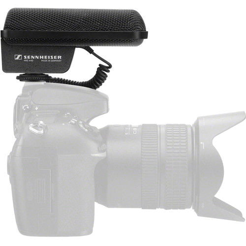 Black stereo shotgun microphone mounted on camera with foam windscreen