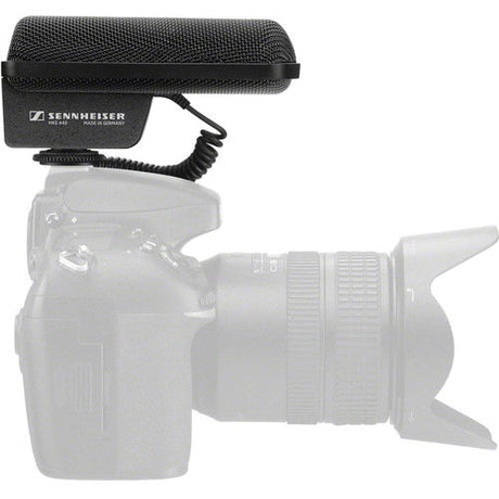 Black stereo shotgun microphone mounted on camera with foam windscreen