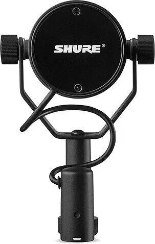 Black broadcast microphone with circular top plate and adjustment knobs, front view