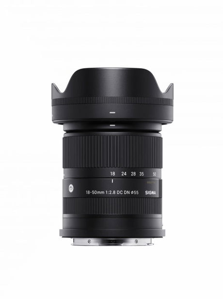 Black Sigma 18-50mm f/2.8 DC DN lens for mirrorless, front view with hood