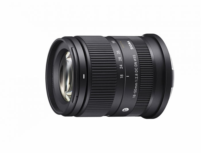 18-50mm f/2.8 DC DN lens angled view, visible front glass and ridged rings