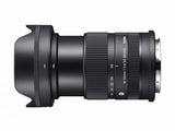 Black 18-50mm f/2.8 DC DN lens, angled side view showing zoom ring and mount