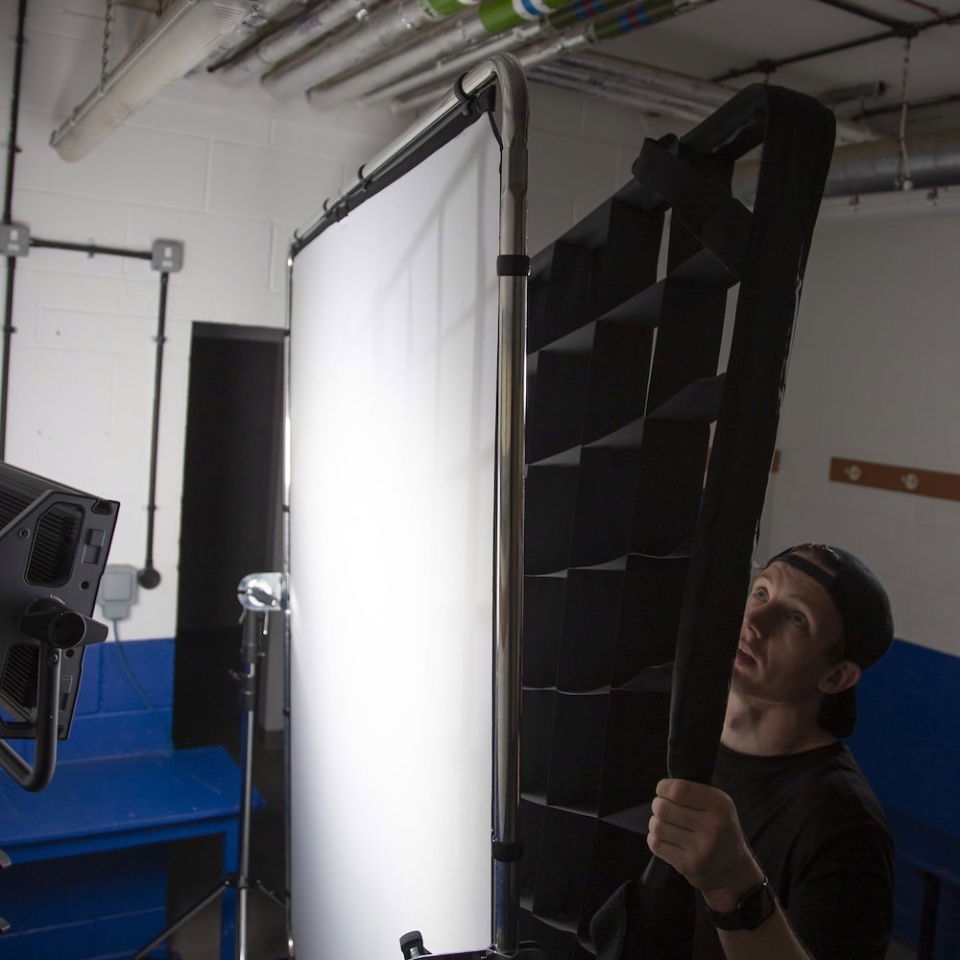 Large studio frame with hinged panel and mounted rods