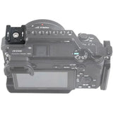 Camera with top-mounted accessory bracket and metal rails, showing mounting holes