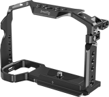 Metal camera cage frame with top handle, screw mounts, and side access holes