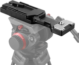 QR tripod plate mounted on a camera rig with release lever and metal base